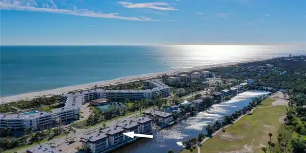 Image 3: Bird's eye view of apartment complex / building and a nearby body of water