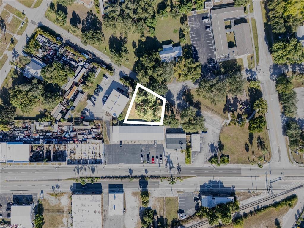 Image 2: Aerial view of property and surrounding area