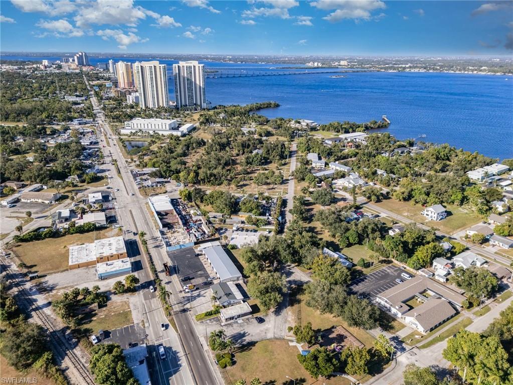 Image 4: Aerial view of property's location with a large body of water