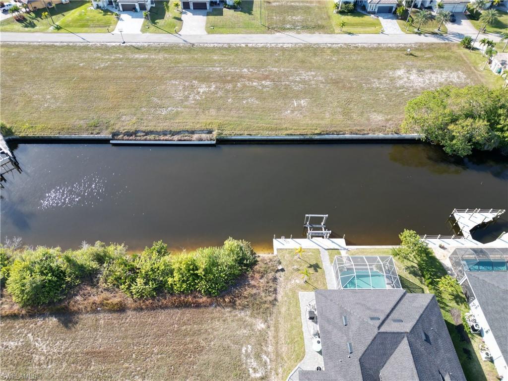 Image 3: Aerial view of residential area featuring a large body of water