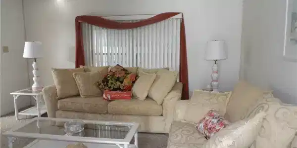 Image 4: Living area featuring carpet and ceiling fan