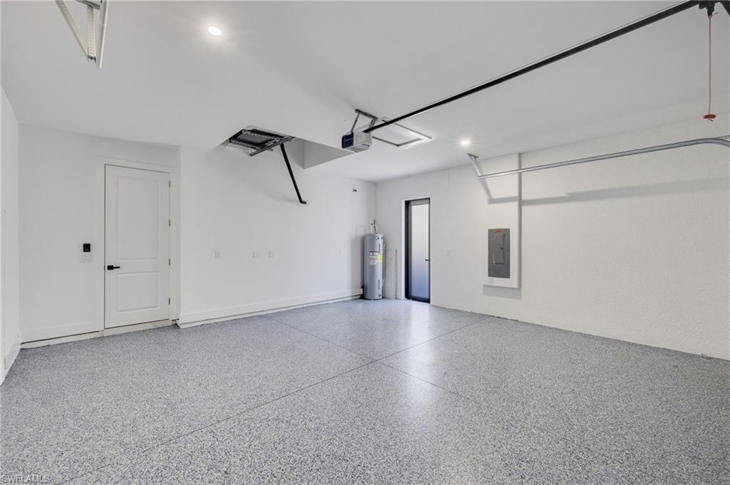 Image 3: Garage featuring epoxy flooring
