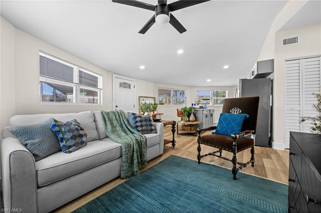 Image 2: Living room featuring a ceiling fan, wood finished floors, and recessed lighting