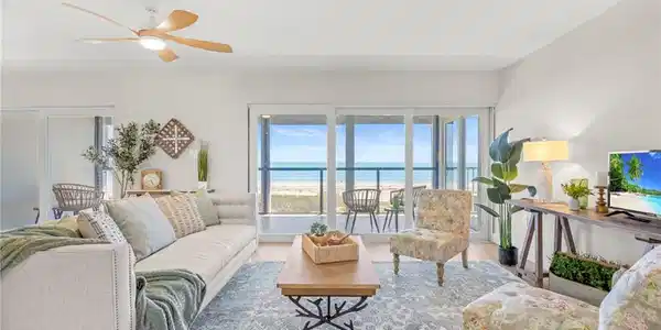 Image 3: Living area featuring ceiling fan and wood finished floors