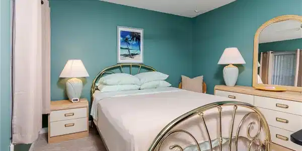 Image 2: Bedroom featuring ceiling fan & walk-in closet