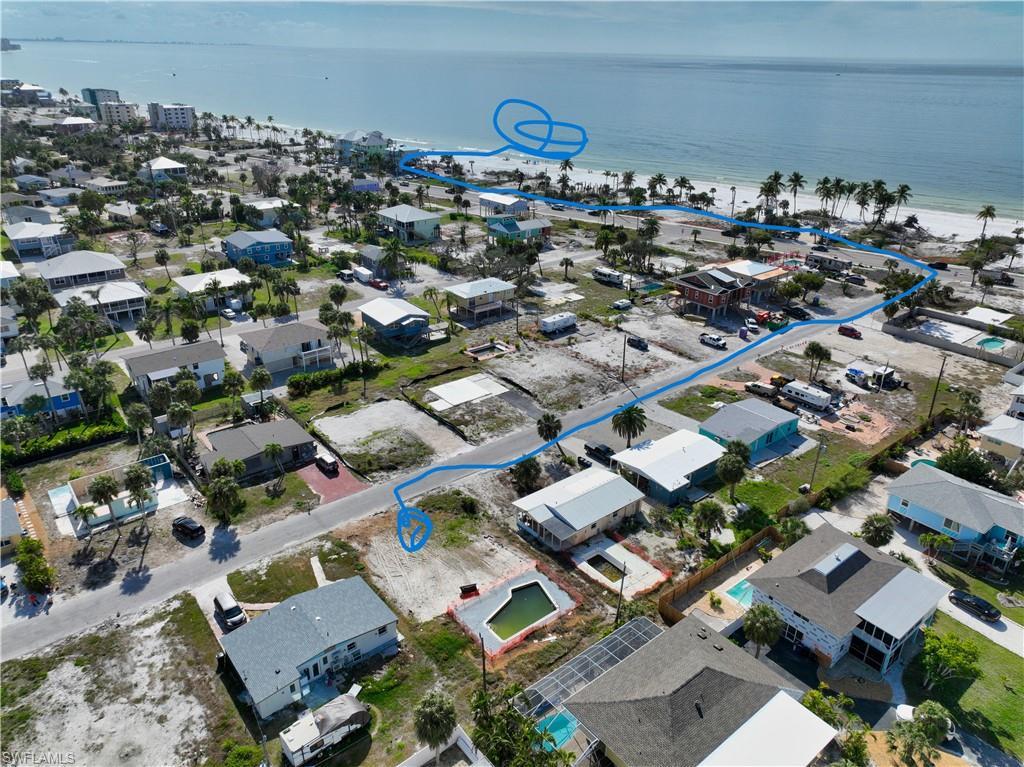 Image 1: Aerial view featuring a water view