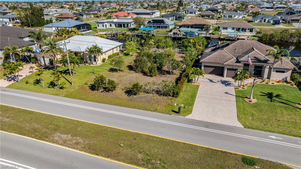 Image 2: Drone / aerial view with a residential view