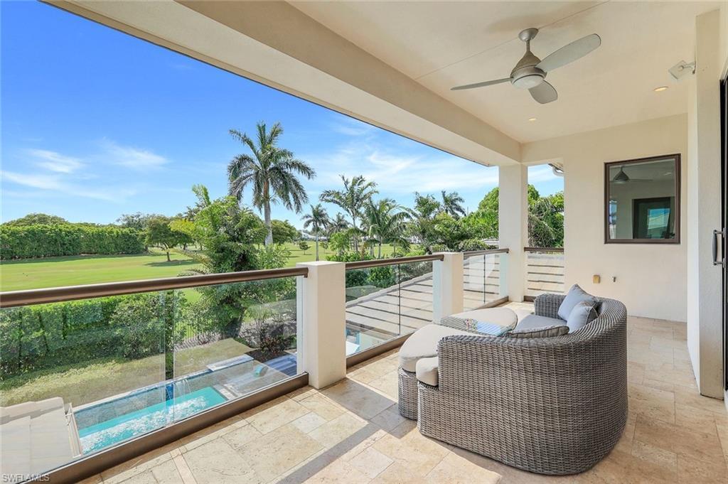 Image 4: 2nd Floor Balcony featuring ceiling fan, view of golf course, and view of pool