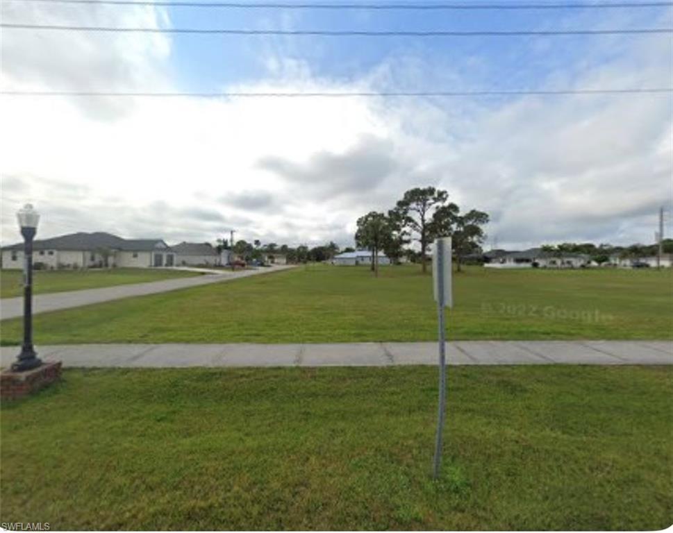 Image 1: Surrounding community with a lawn