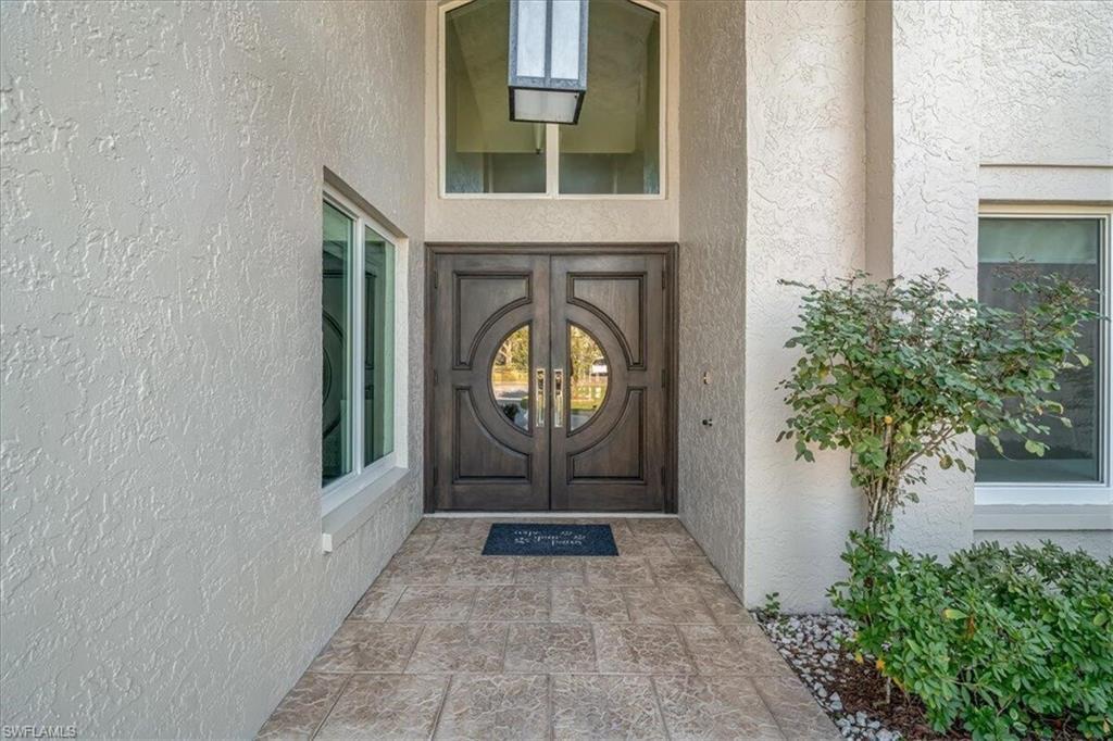 Image 4: Doorway to property with stucco siding