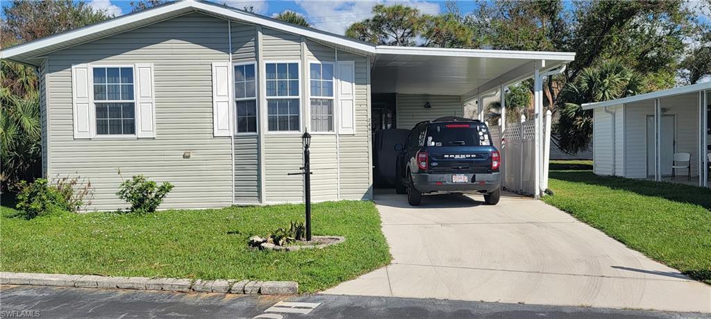 Image 1: Covered carport