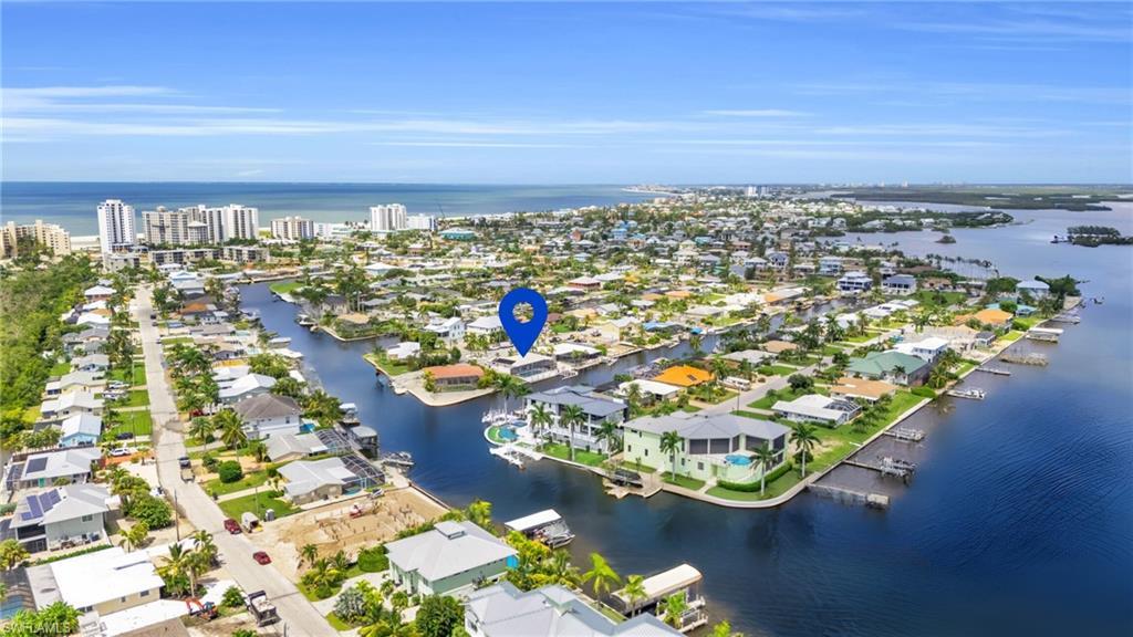 Image 2: Boaters dream location - Birds eye view of property with a water view, with the Gulf Of VIRTUALLY ENHANCED - Mexico in the background