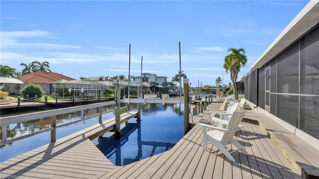 Image 3: Captains Walk boat dock featuring all new composite material decking for life long low maintenance. Sit and relax while waiting for the boaters to return from the open waters of the Gulf of America!