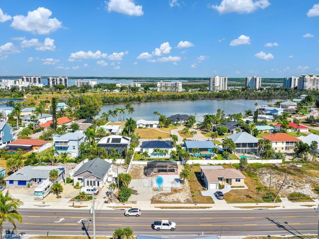 Image 3: View of urban area with a large body of water and nearby suburban area