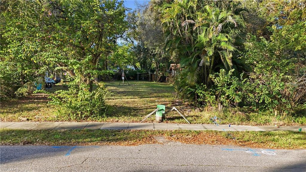 Image 2: View of yard with view of scattered trees