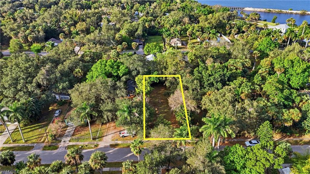 Image 3: Aerial overview of property's location with a large body of water