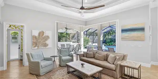 Image 4: Living area featuring a sunroom, ceiling fan, light tile patterned floors, and ornamental molding