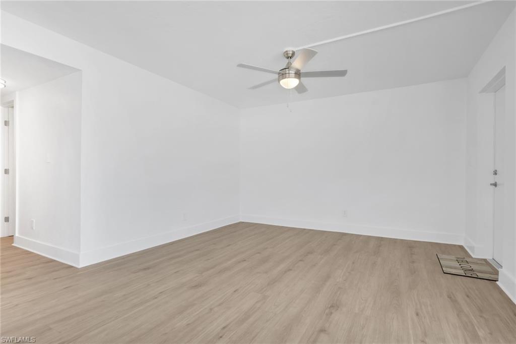 Image 4: Spare room with light wood-type flooring and ceiling fan