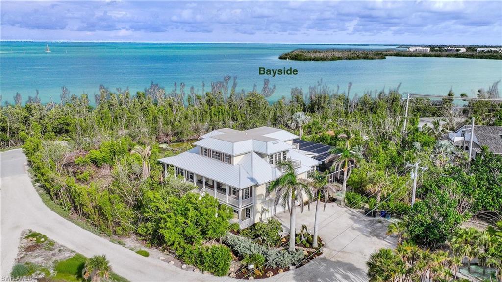 Image 2: View from above of property with a large body of water