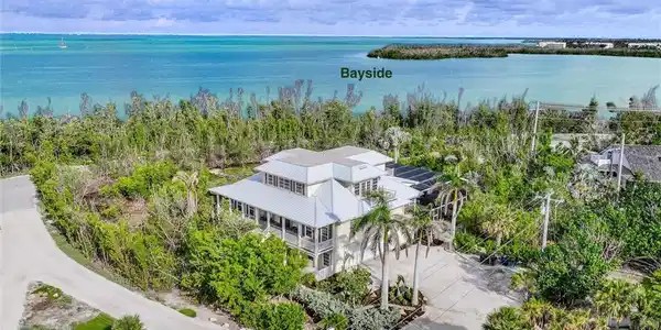 Image 2: View from above of property with a large body of water
