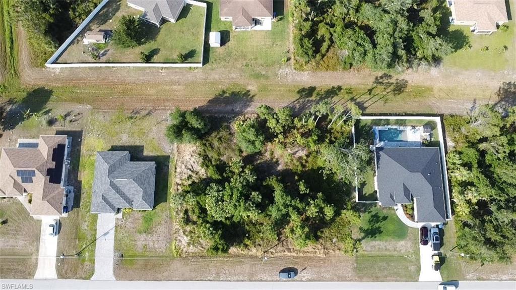 Image 1: Aerial perspective of suburban area
