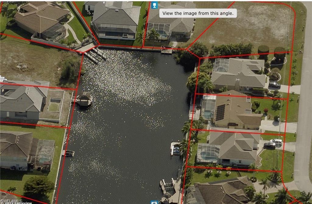 Image 1: Aerial overview of property's location featuring property parcel outlined