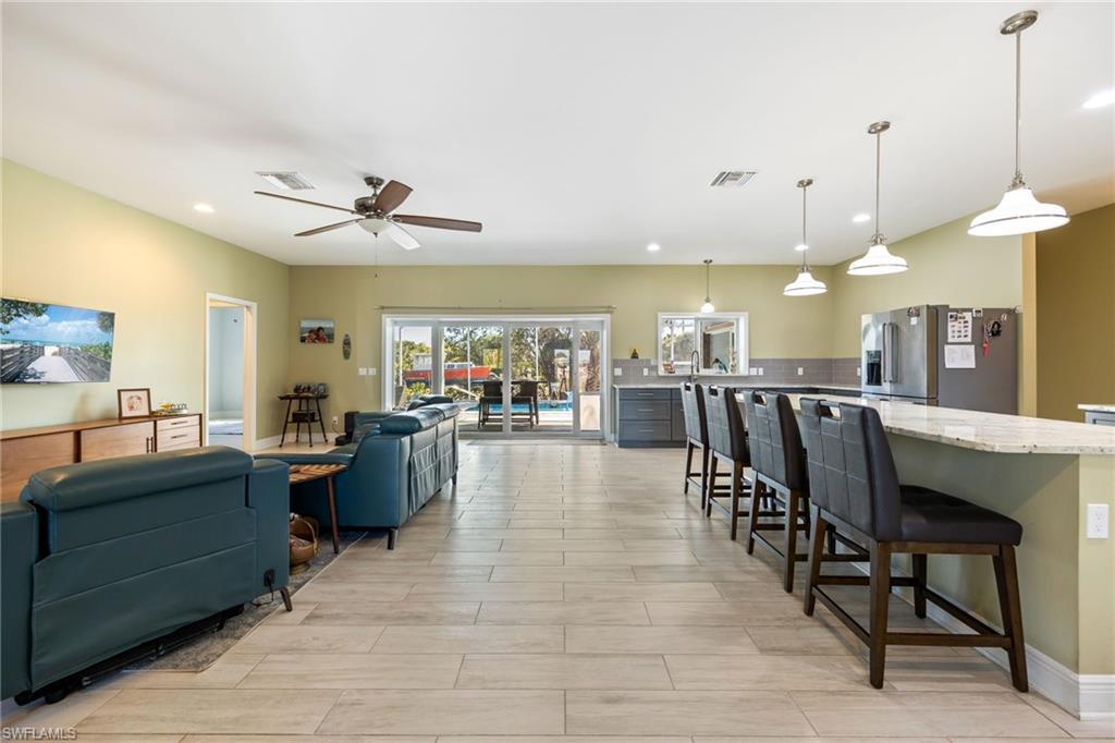 Image 4: Living room featuring recessed lighting, ceiling fan, and wood finish floors