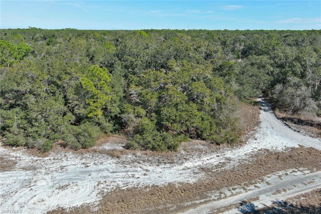 Image 3: Aerial view of property and surrounding area