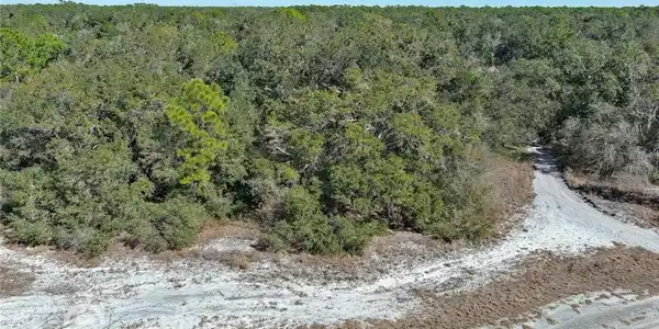 Image 3: Aerial view of property and surrounding area