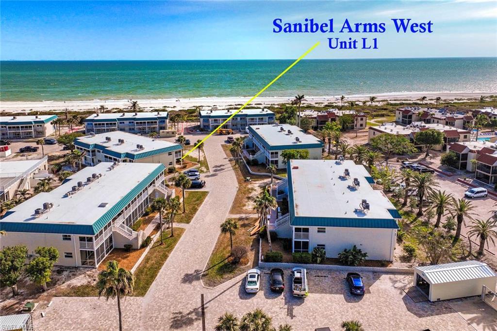 Image 1: Bird's eye view with a beach view and a water view