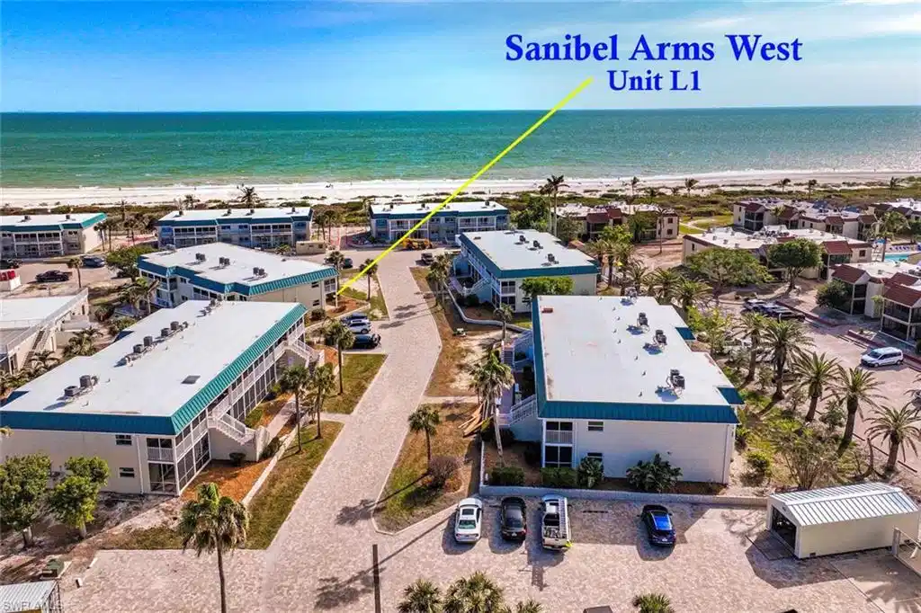 Image 1: Bird's eye view with a beach view and a water view