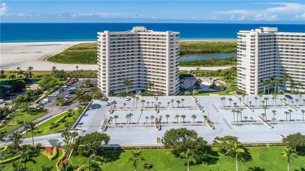 Image 1: Birds eye view of property featuring a water view and a view of the beach