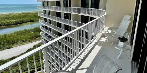 Image 2: Balcony featuring a water view