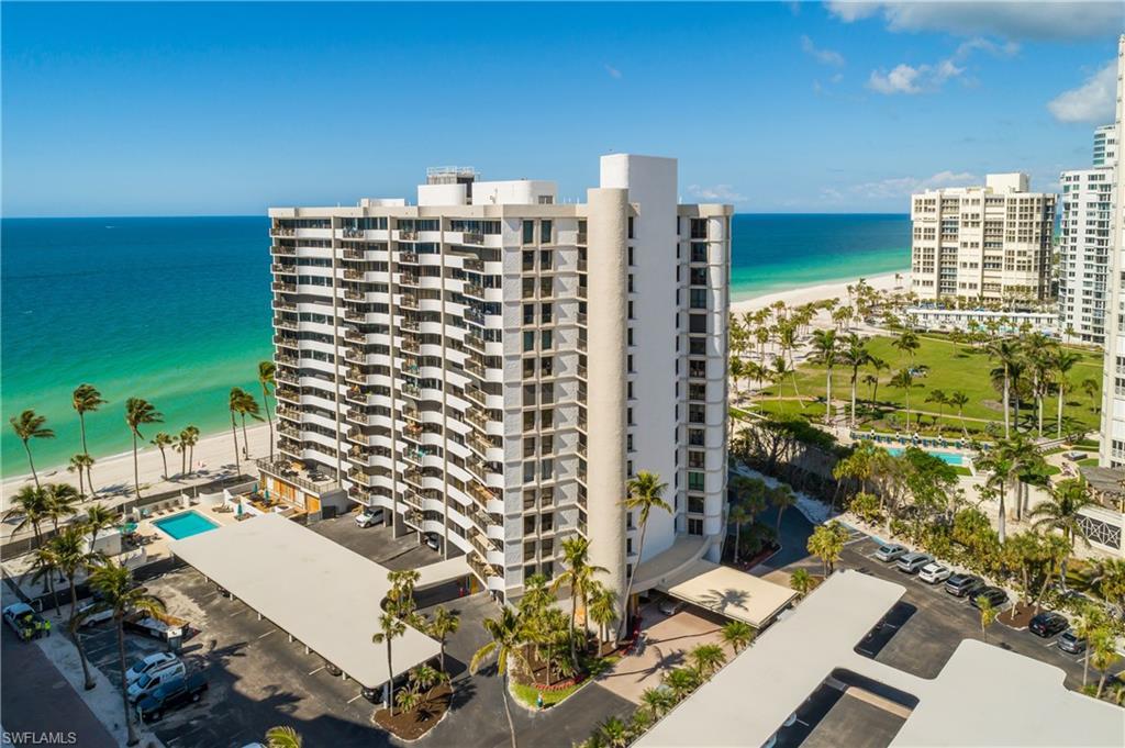 Image 2: View of building exterior featuring a beach view and a water view