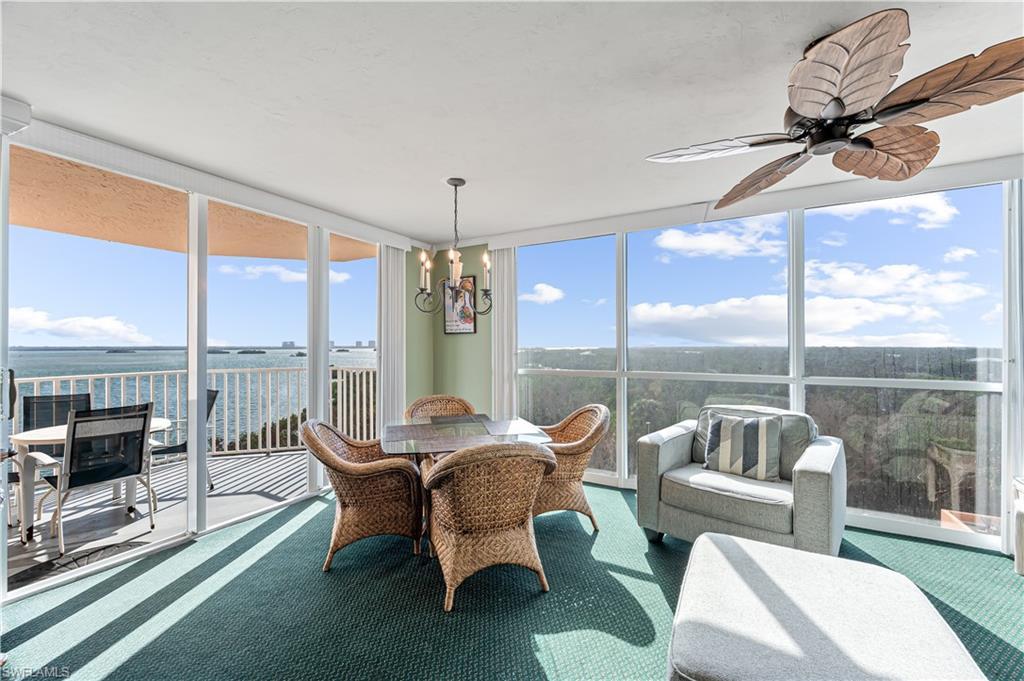 Image 2: Sunroom / solarium with a water view and ceiling fan Virtually edited image
