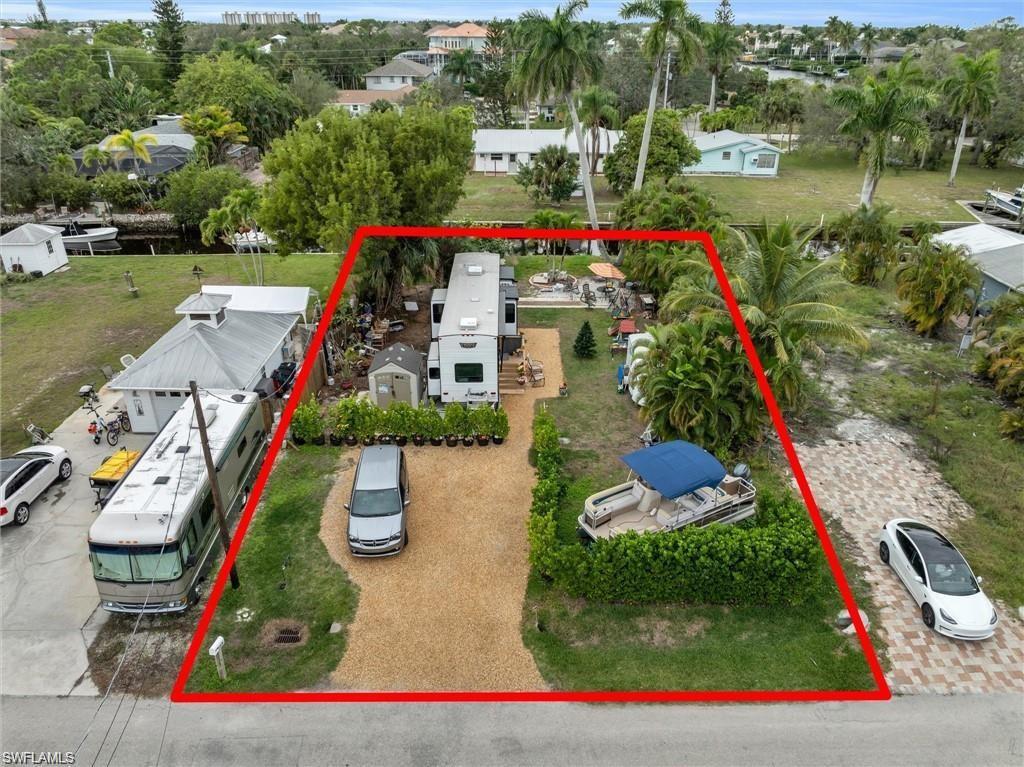 Image 3: Aerial view of property and surrounding area featuring property boundaries highlighted