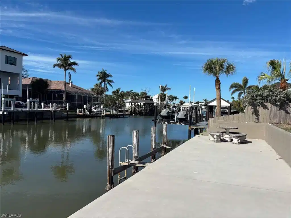 Image 1: Dock area with a water view and fence