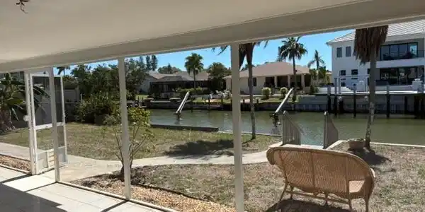 Image 4: Sunroom with a water view