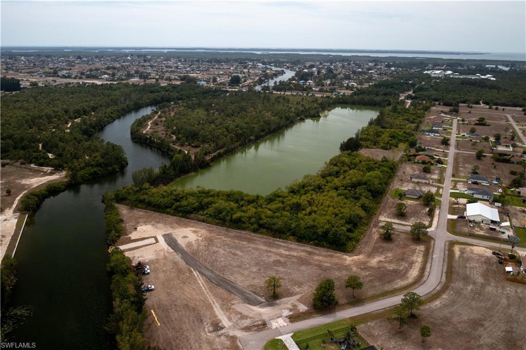 Image 4: View of apartment building / complex with a water view