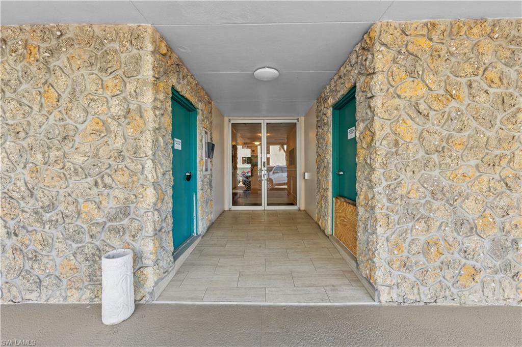 Image 2: Entrance to property with french doors
