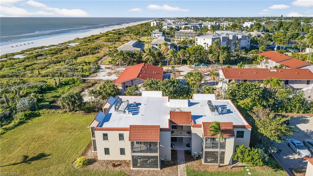 Image 1: Drone / aerial view of waterfront with a beach