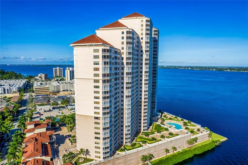 Image 4: View of building exterior featuring a water view