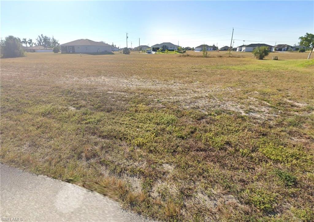 Image 1: View of yard featuring a residential view