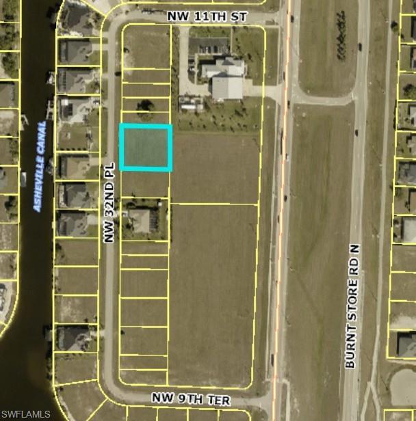 Image 1: Aerial view of property's location featuring property boundaries highlighted