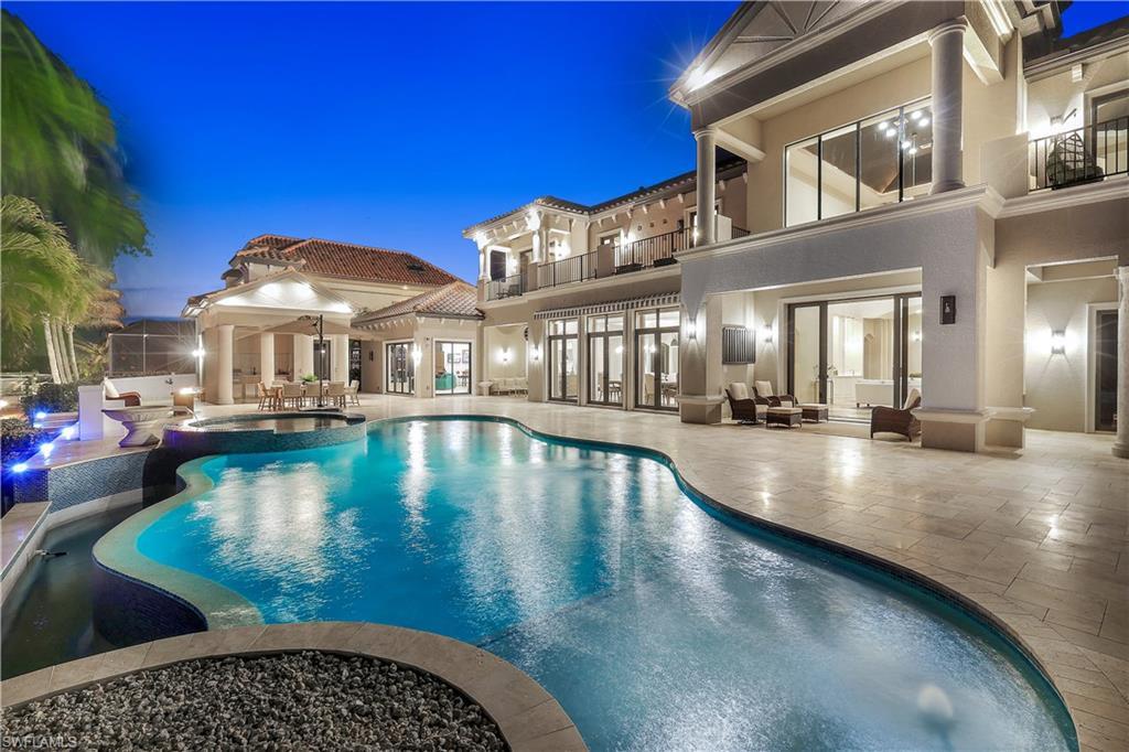 Image 2: Relaxing pool / spa with a balcony, a patio area, outdoor furniture, and french doors