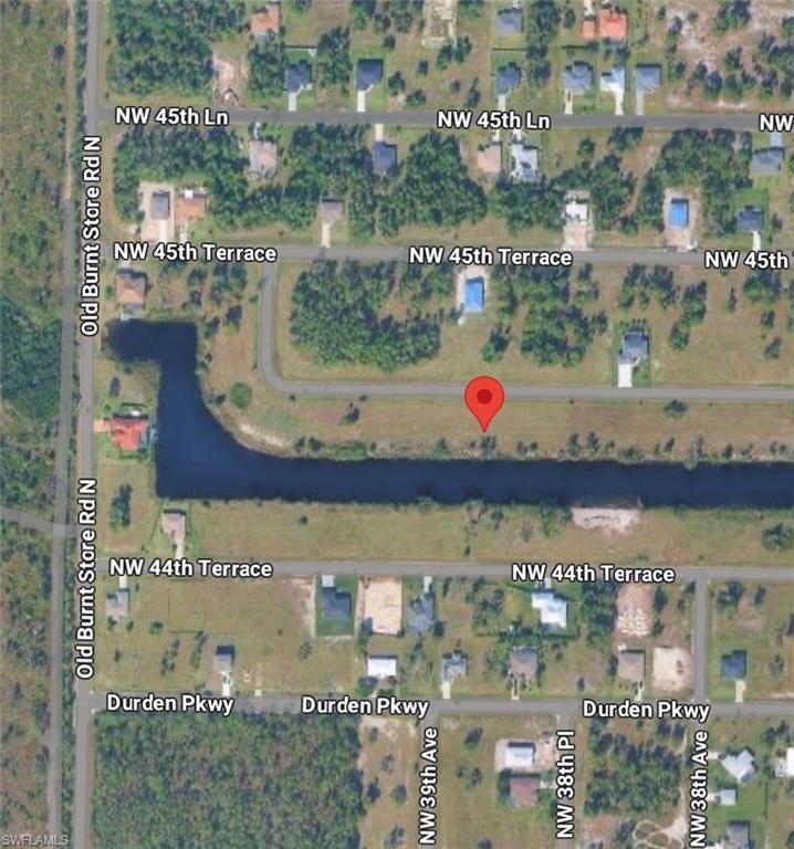 Image 1: Aerial overview of property's location featuring property boundaries highlighted