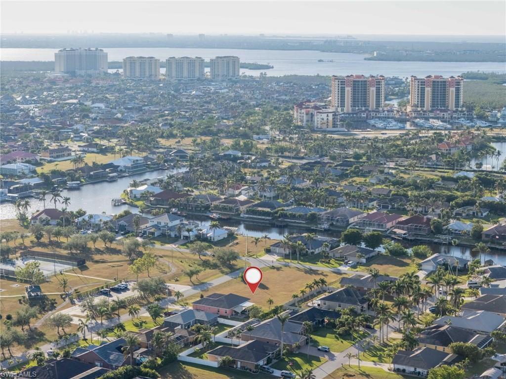Image 1: Bird's eye view with a water view