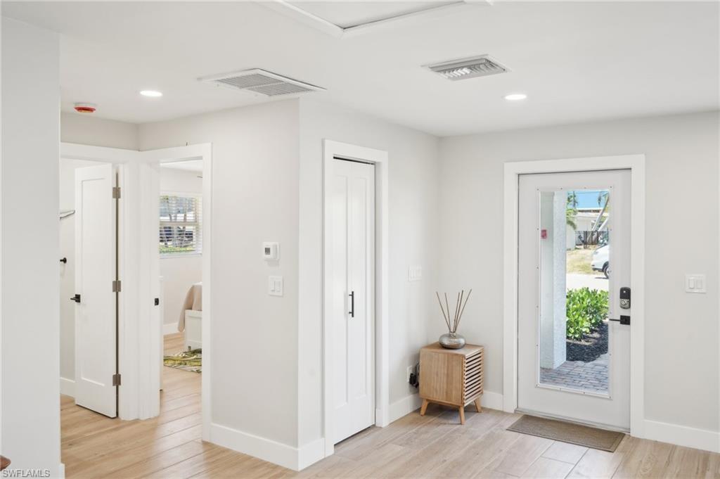 Image 4: Entrance foyer with healthy amount of natural light, light wood-type flooring, baseboards, and recessed lighting