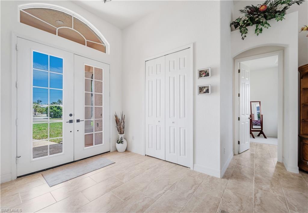 Image 4: Foyer featuring french doors and arched walkways