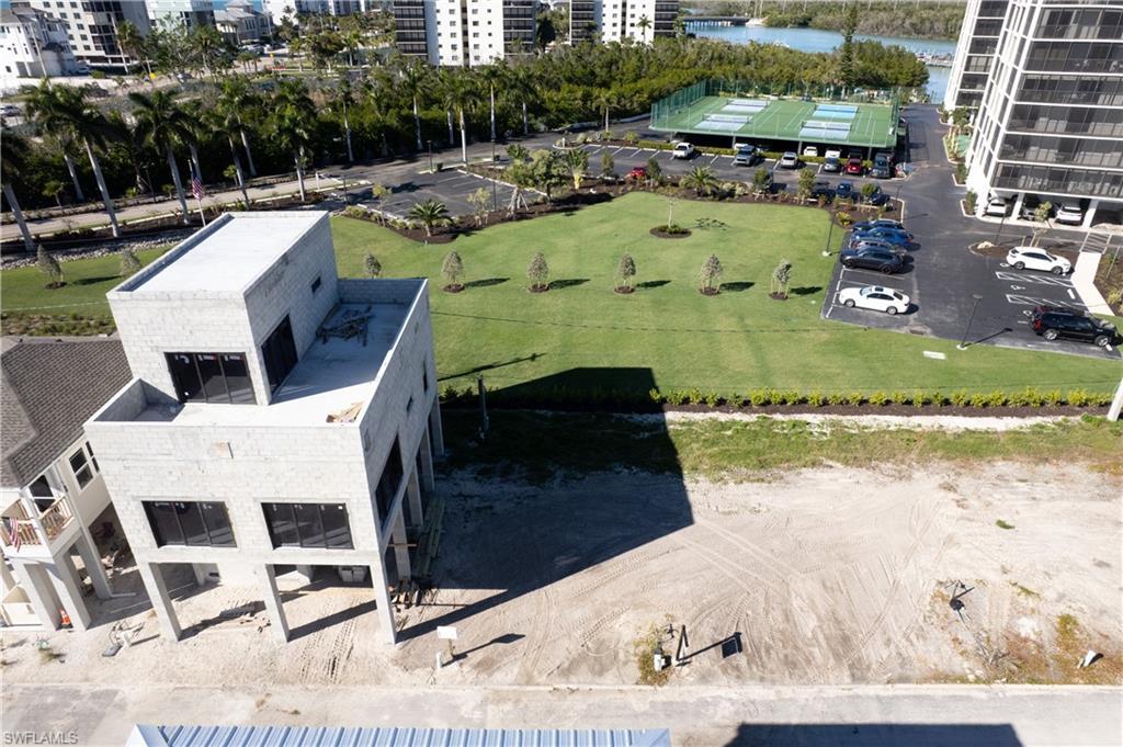 Image 2: Lot #36, next to home being built with landscaped views out the back of the property.